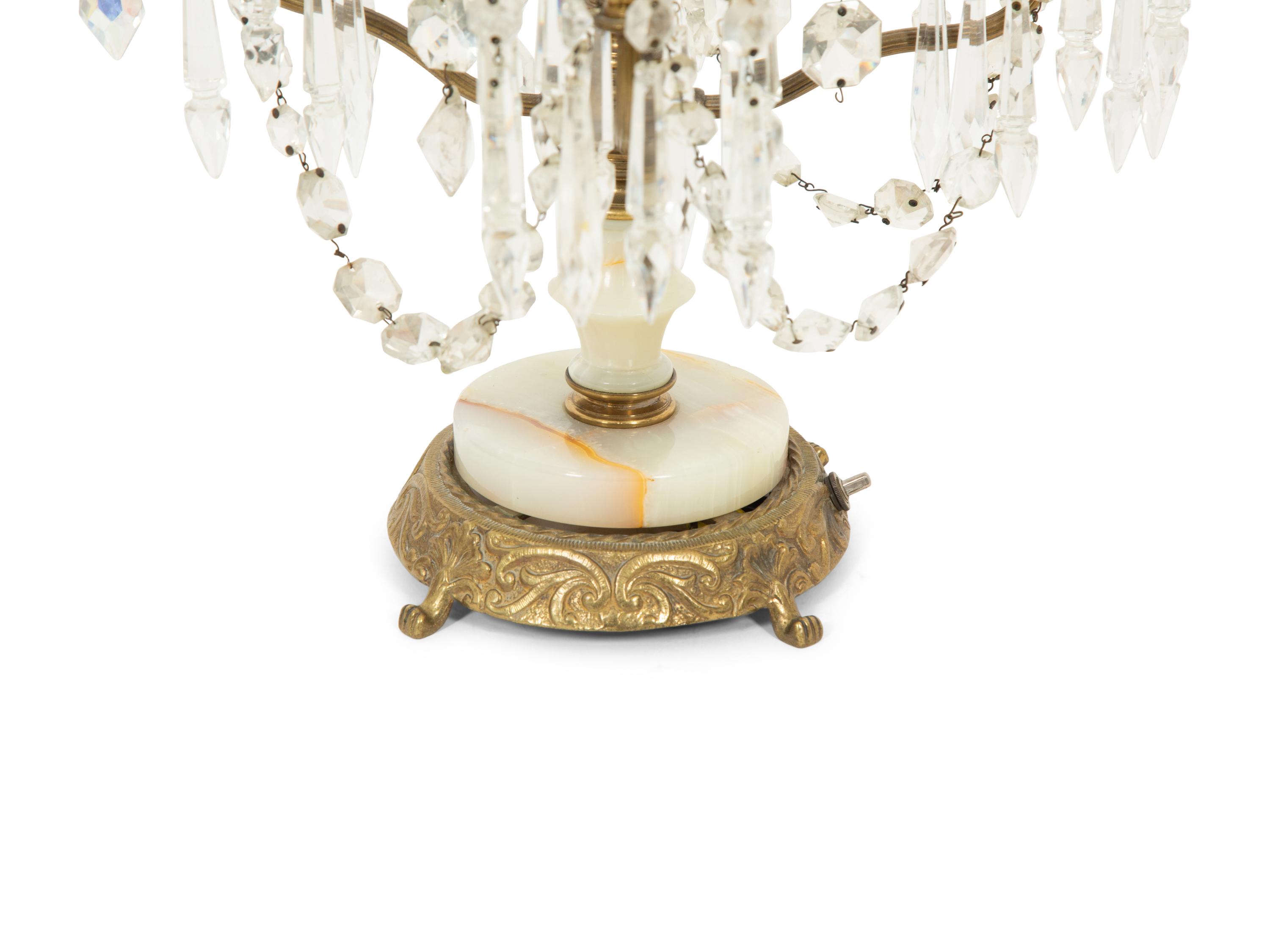 A Pair of Gilt Metal, Onyx, and Cut Glass Four Light Girandoles