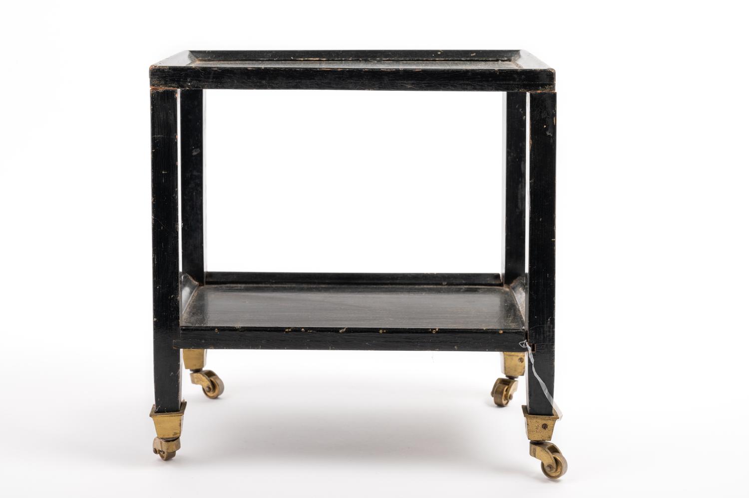 A Black Painted "Telephone Table" in the Style of Karl Springer