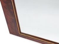 An Empire Style Gilt Metal Mounted Mahogany Mirror