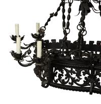 A Wrought Iron Chandelier in the Style of Addison Mizner — 20th Century