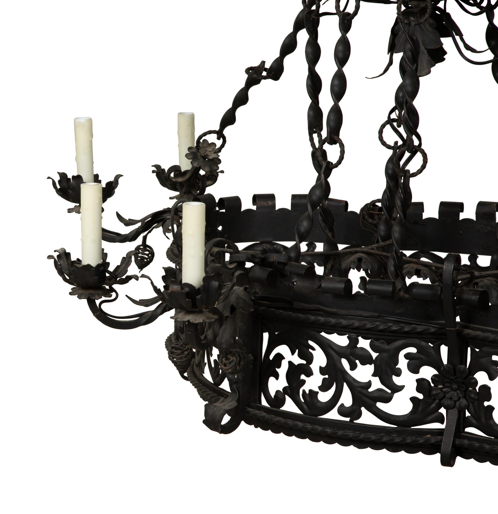 A Wrought Iron Chandelier in the Style of Addison Mizner — 20th Century
