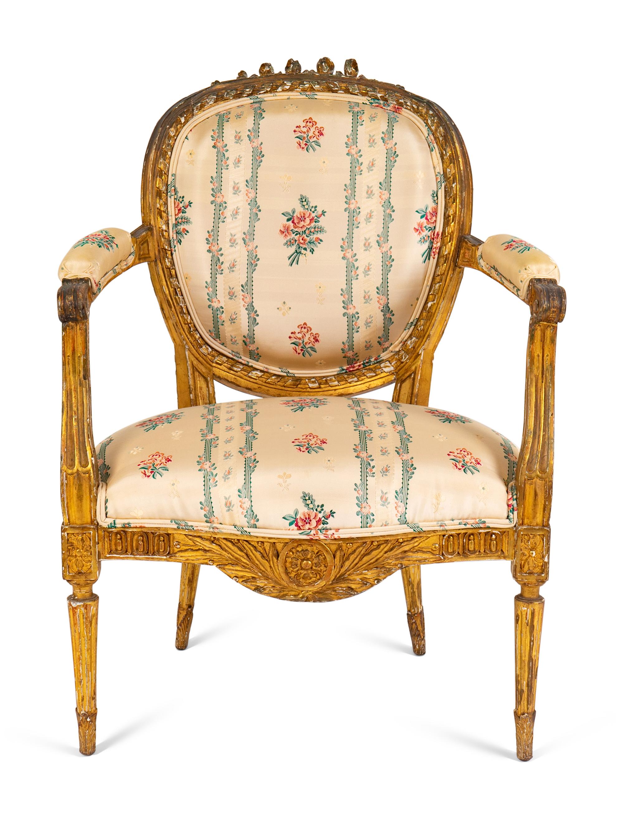 A Louis XVI Carved Giltwood Fauteuil — LATE 18TH/EARLY 19TH CENTURY