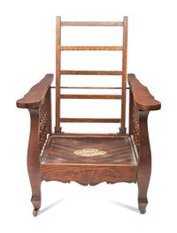 A Victorian Carved Mahogany and Tufted Velvet Upholstered Child's Reclining Armchair
