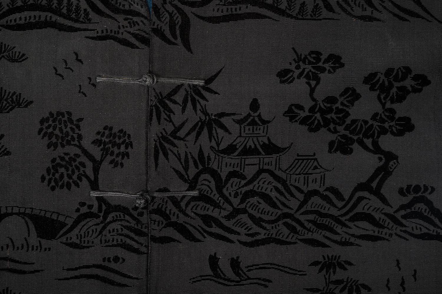A Chinese Black Ground Silk Twill and Cut Velvet Jacket