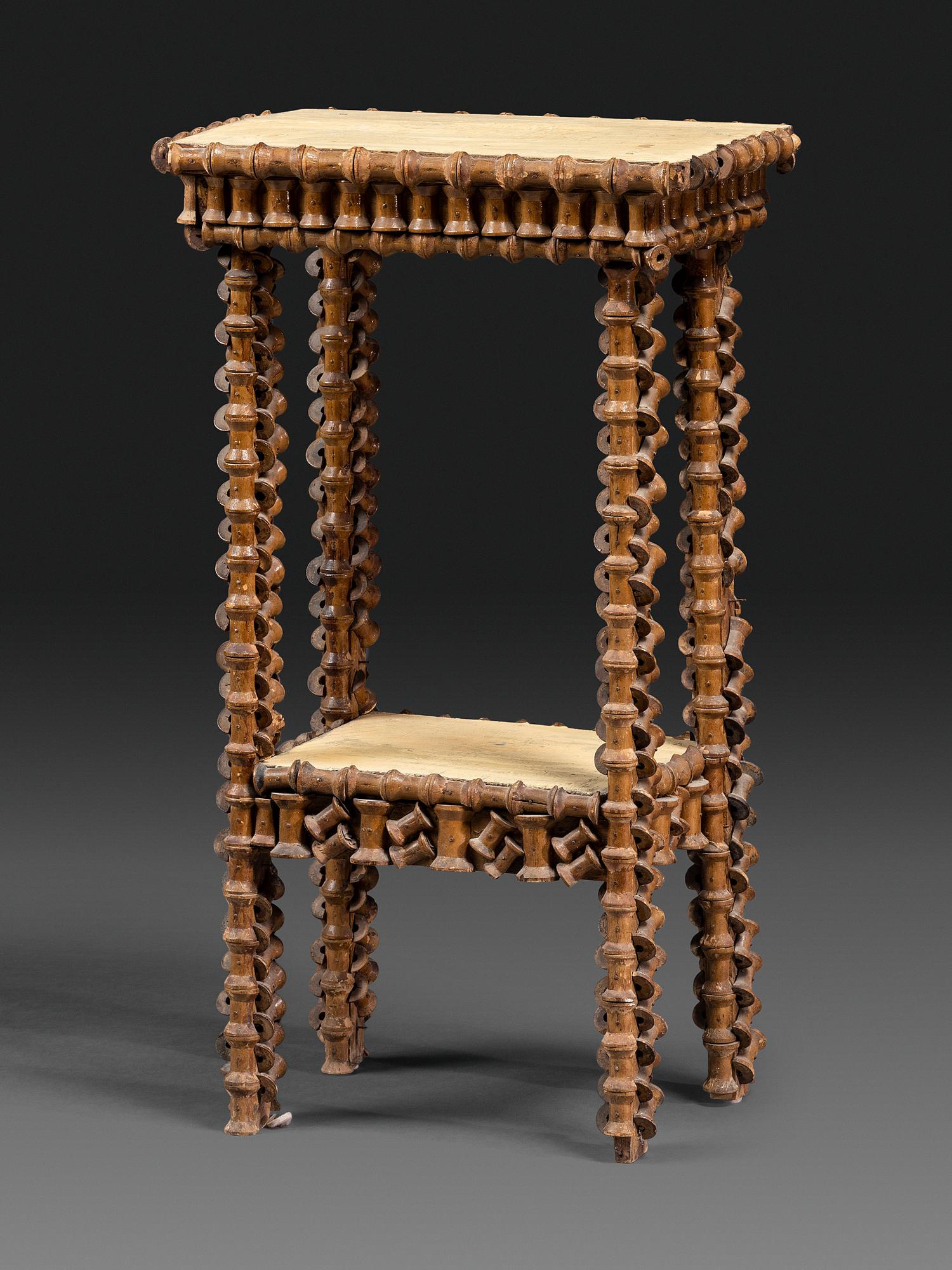 A Folk Art Wood Spool Decorated Pedestal Table