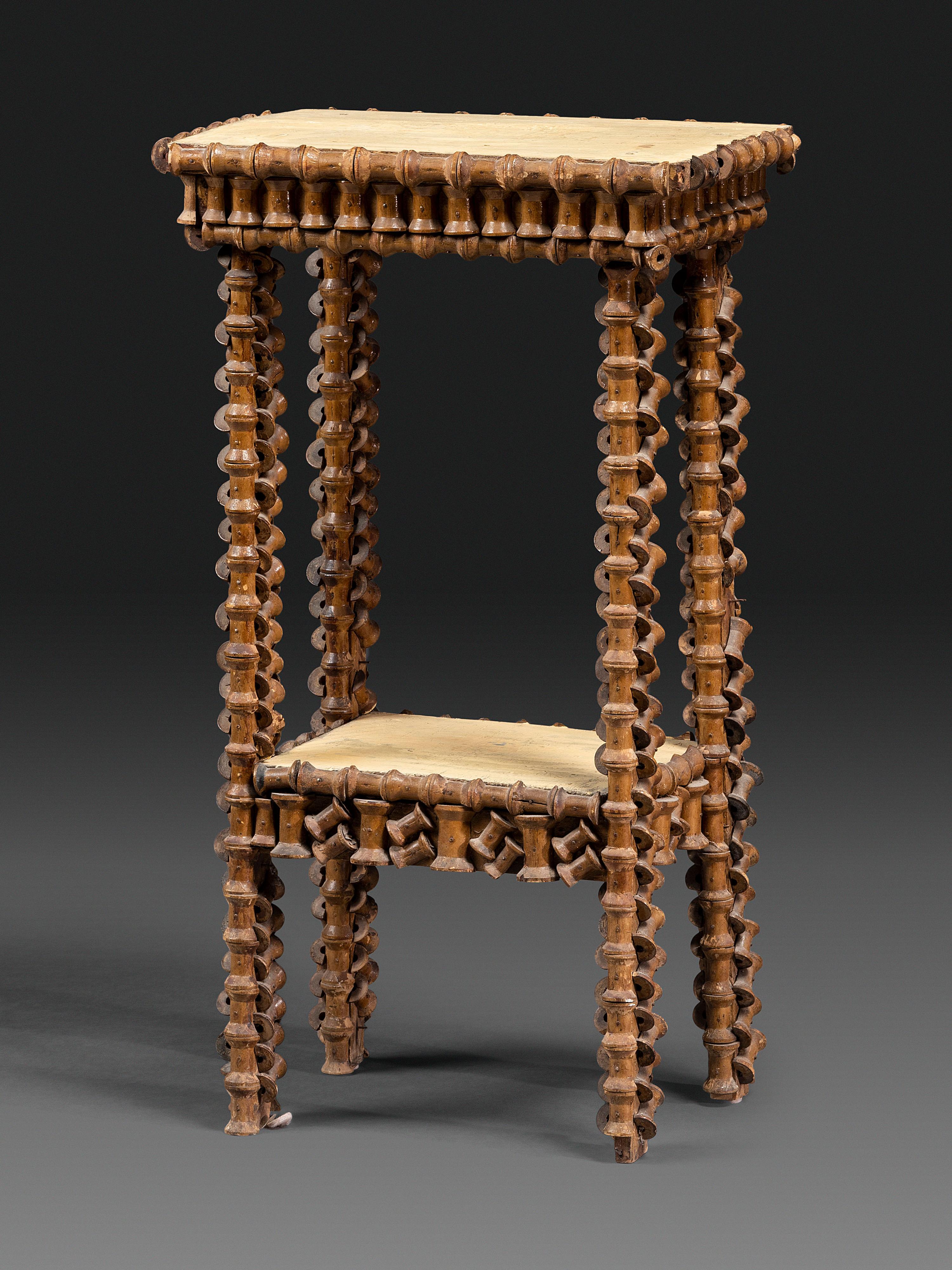 A Folk Art Wood Spool Decorated Pedestal Table