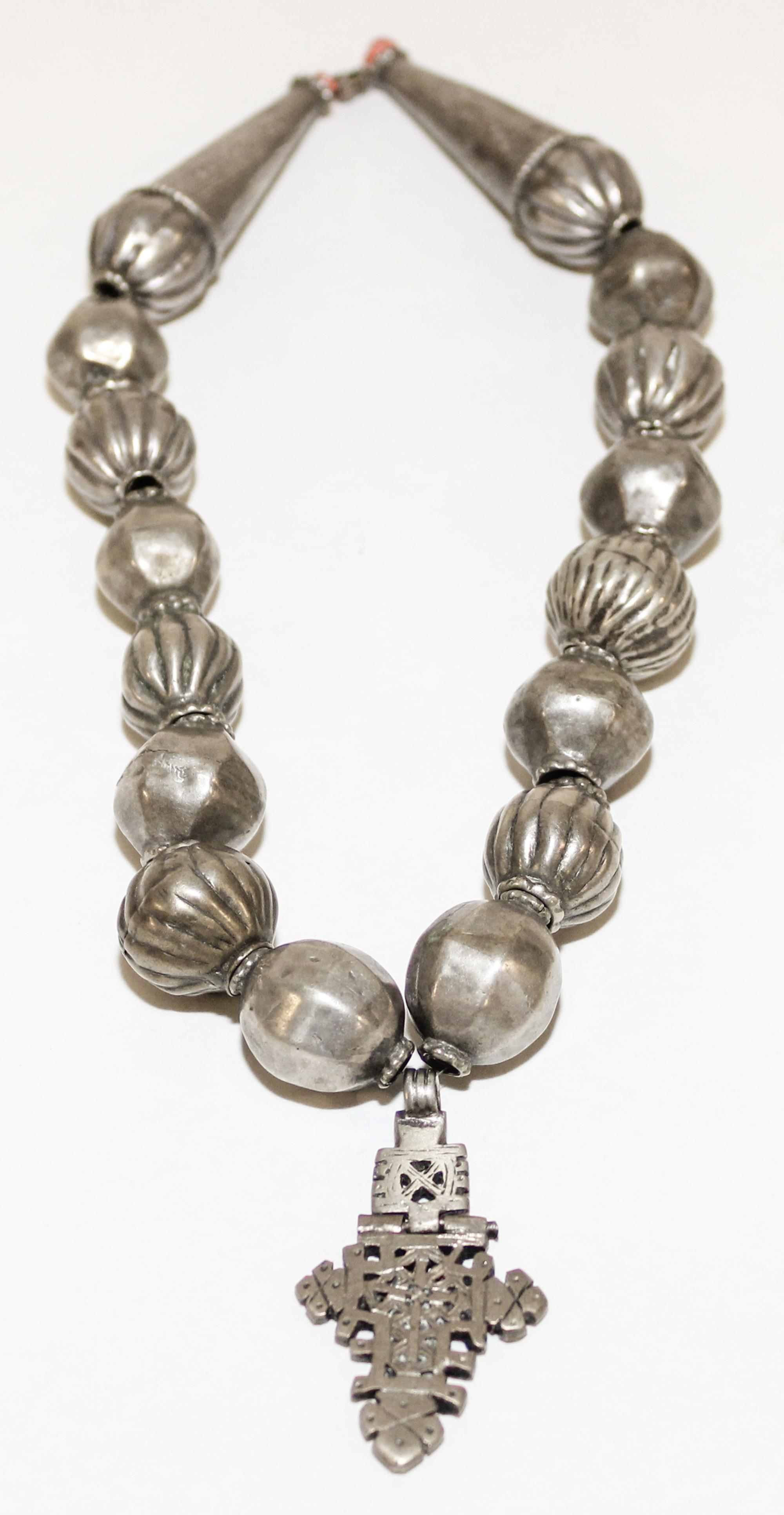 A Silver and Coral Beaded Necklace Length of chain 18 1/2 inches.