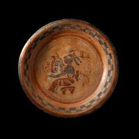 A Maya Polychrome Tripod Plate with a Seated Maize God