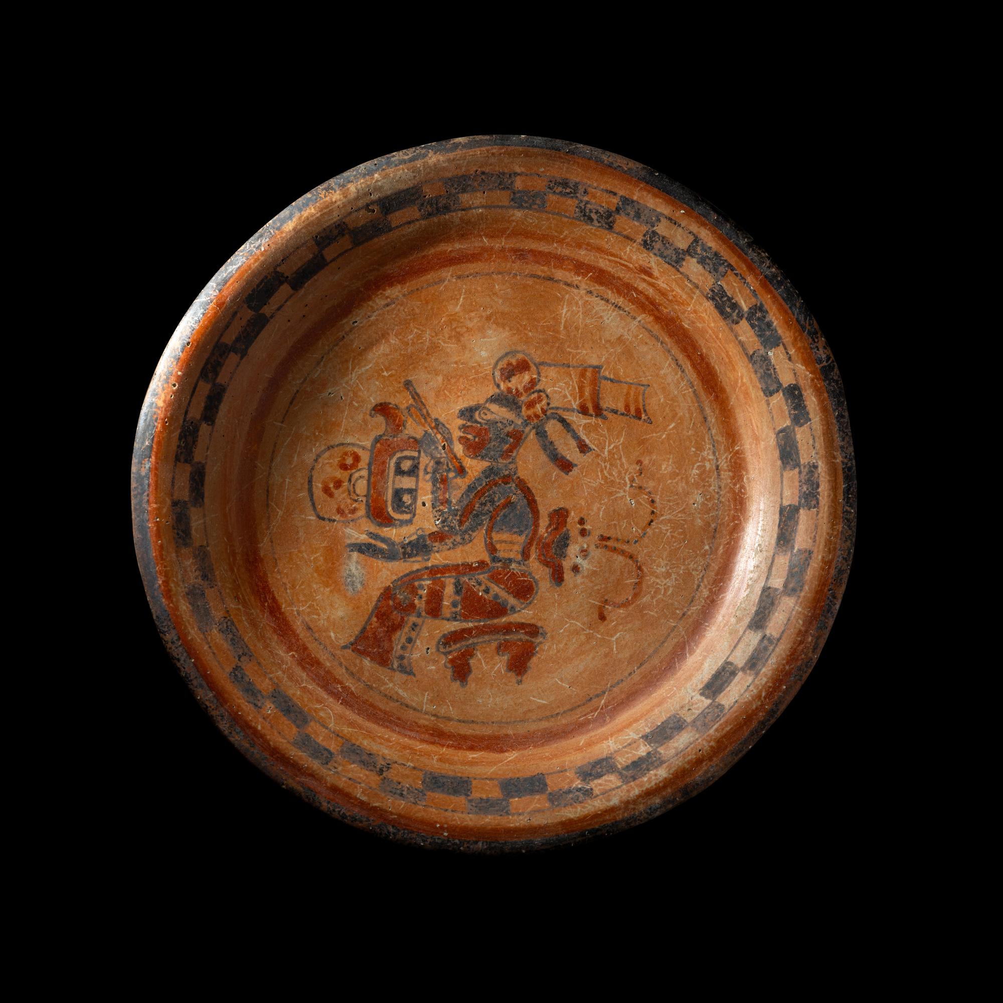 A Maya Polychrome Tripod Plate with a Seated Maize God
