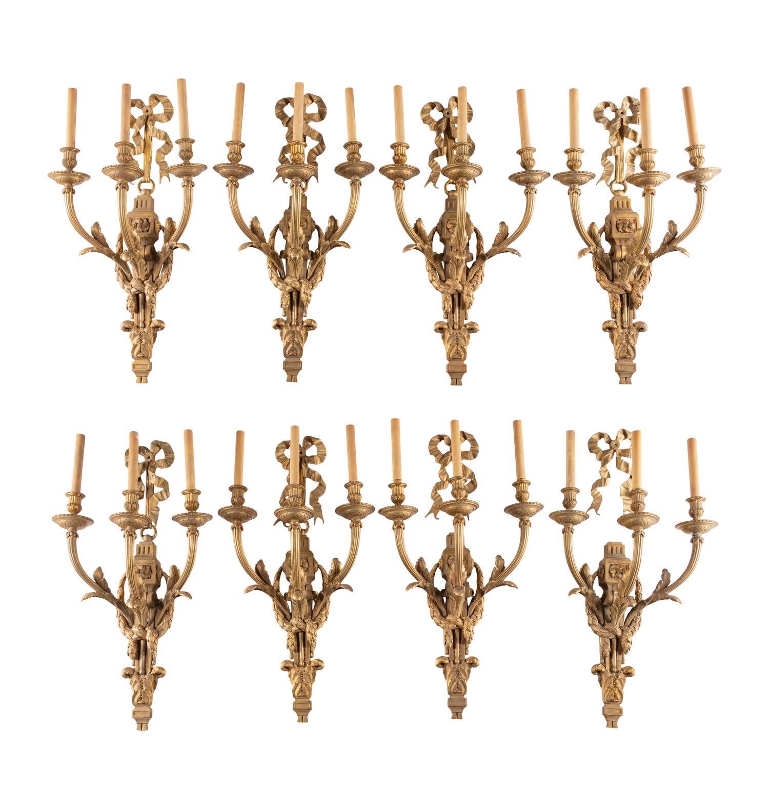 A Set of Eight Louis XVI Style Gilt Bronze Three-Light Sconces