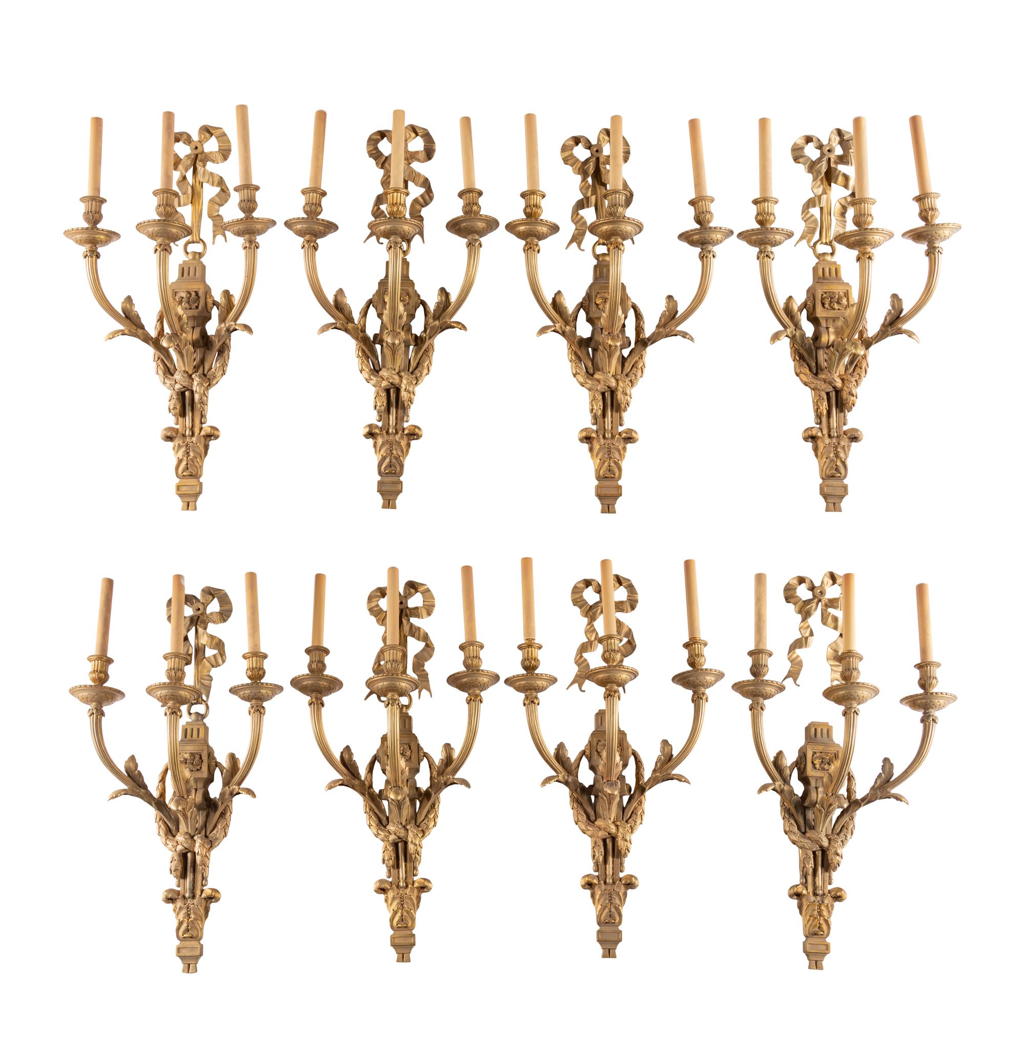 A Set of Eight Louis XVI Style Gilt Bronze Three-Light Sconces