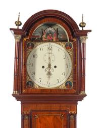 A Regency Brass Inlaid Mahogany Longcase Clock with an Animated Dial