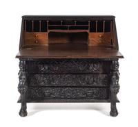 A Renaissance Revival Carved Slant-Front Desk