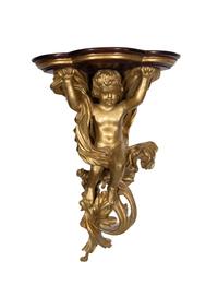 A Gilt Painted Composition and Mahogany Putti-Form Corner Wall Bracket