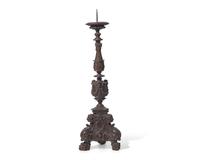 A large Italian Baroque carved walnut pricket candlestick, 16th century