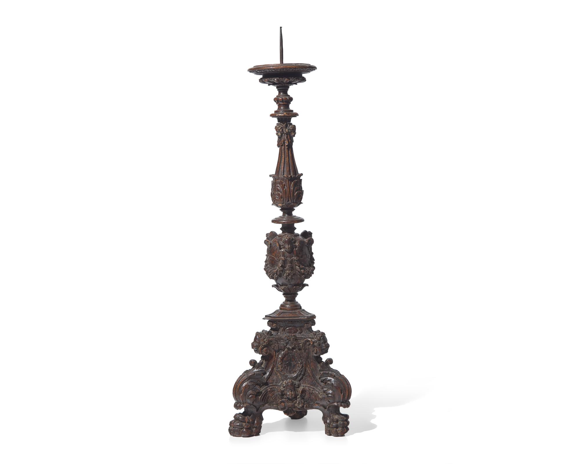 A large Italian Baroque carved walnut pricket candlestick, 16th century