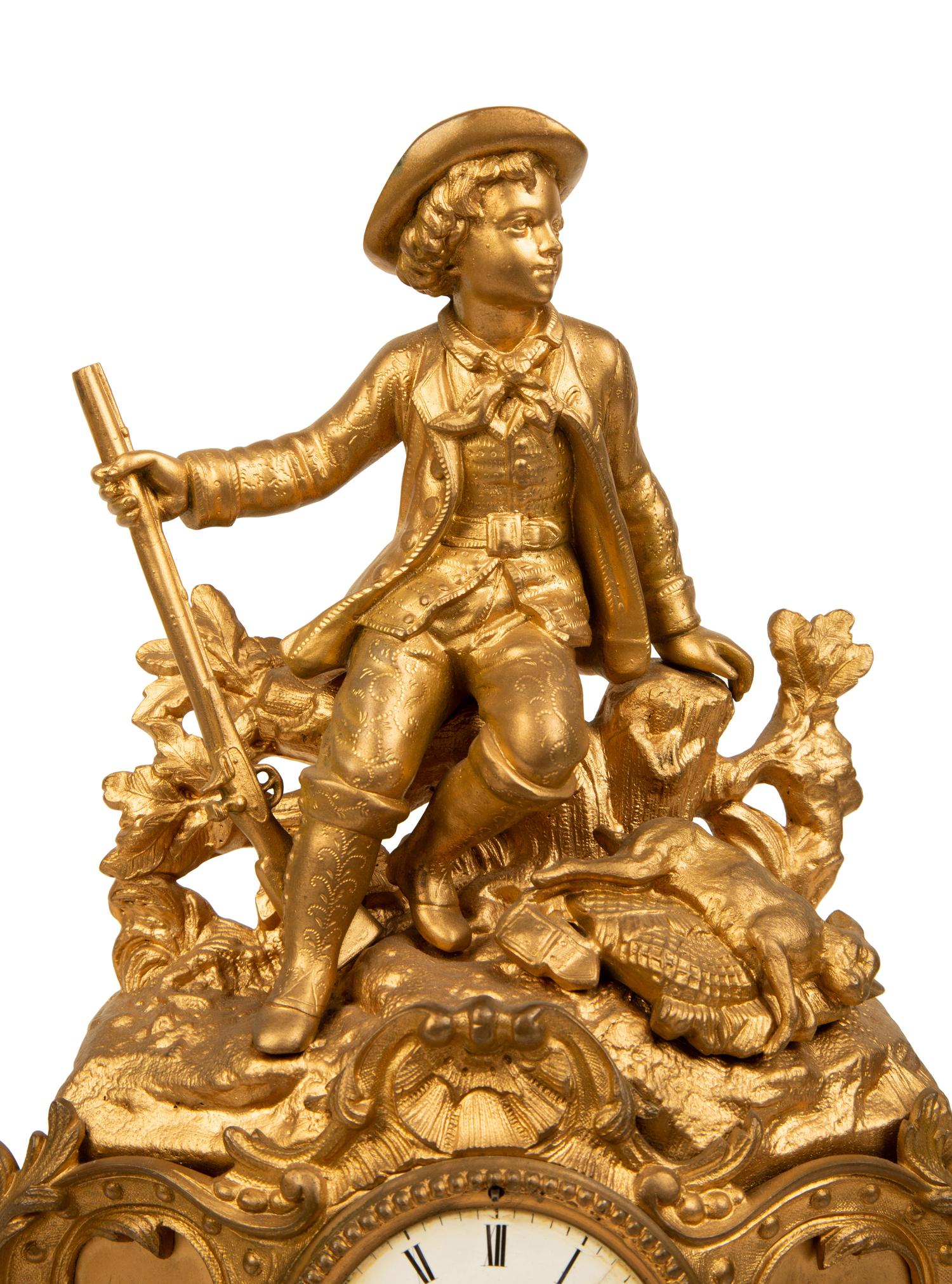 A French Gilt Metal Figural Clock — LATE 19TH CENTURY