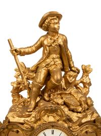 A French Gilt Metal Figural Clock — LATE 19TH CENTURY