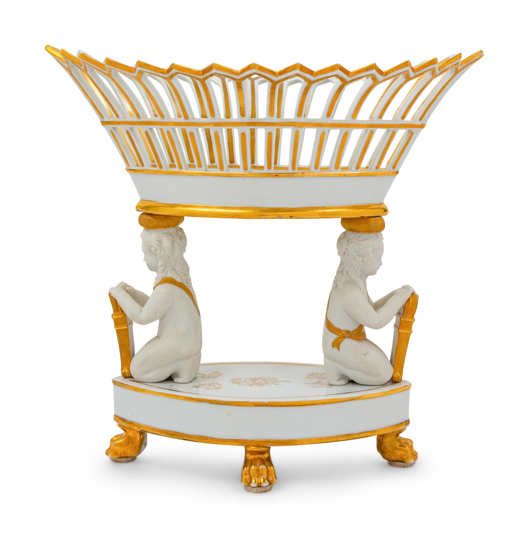 A Paris Porcelain Parcel Gilt Figural Fruit Basket