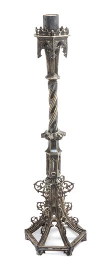 A Gothic Revival Silvered Metal Candlestick Height 21 inches.