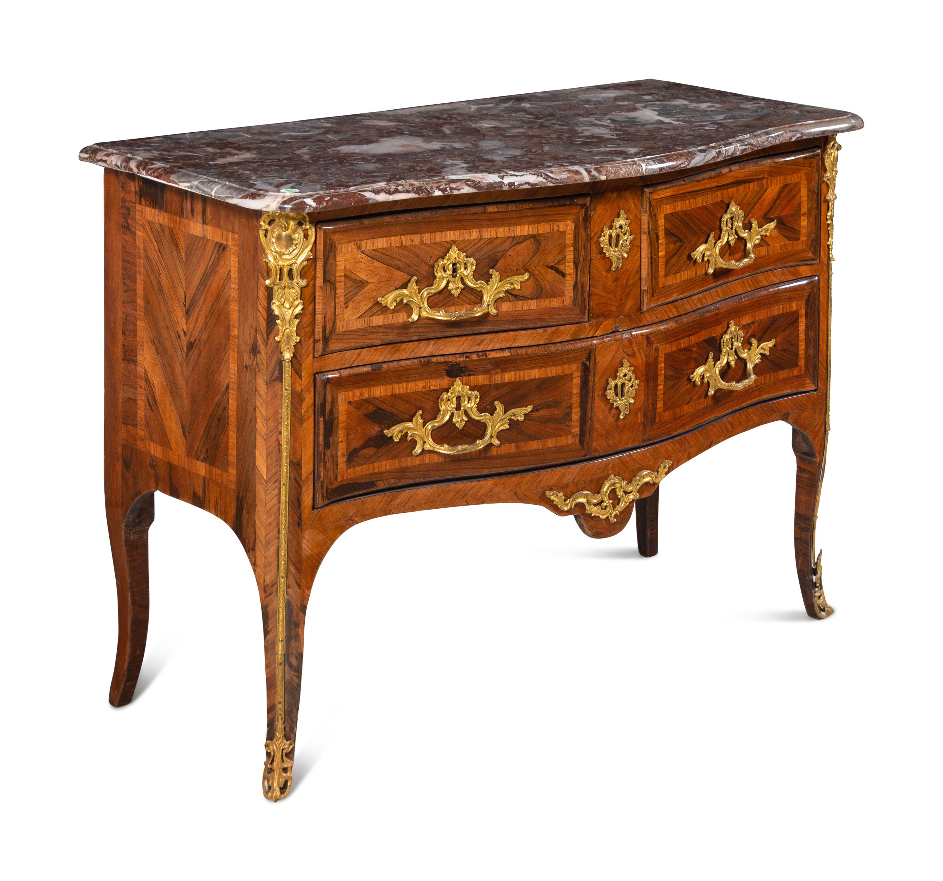 A Régence Gilt Bronze Mounted Marble-Top Commode