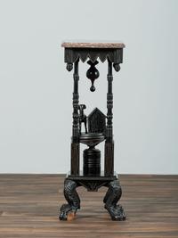 A Victorian Marble-Top Carved and Ebonized Parlor Table with Dog