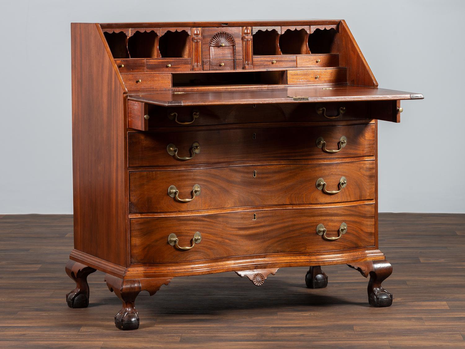 A Chippendale Carved Mahogany Reverse Serpentine Block-Front Desk