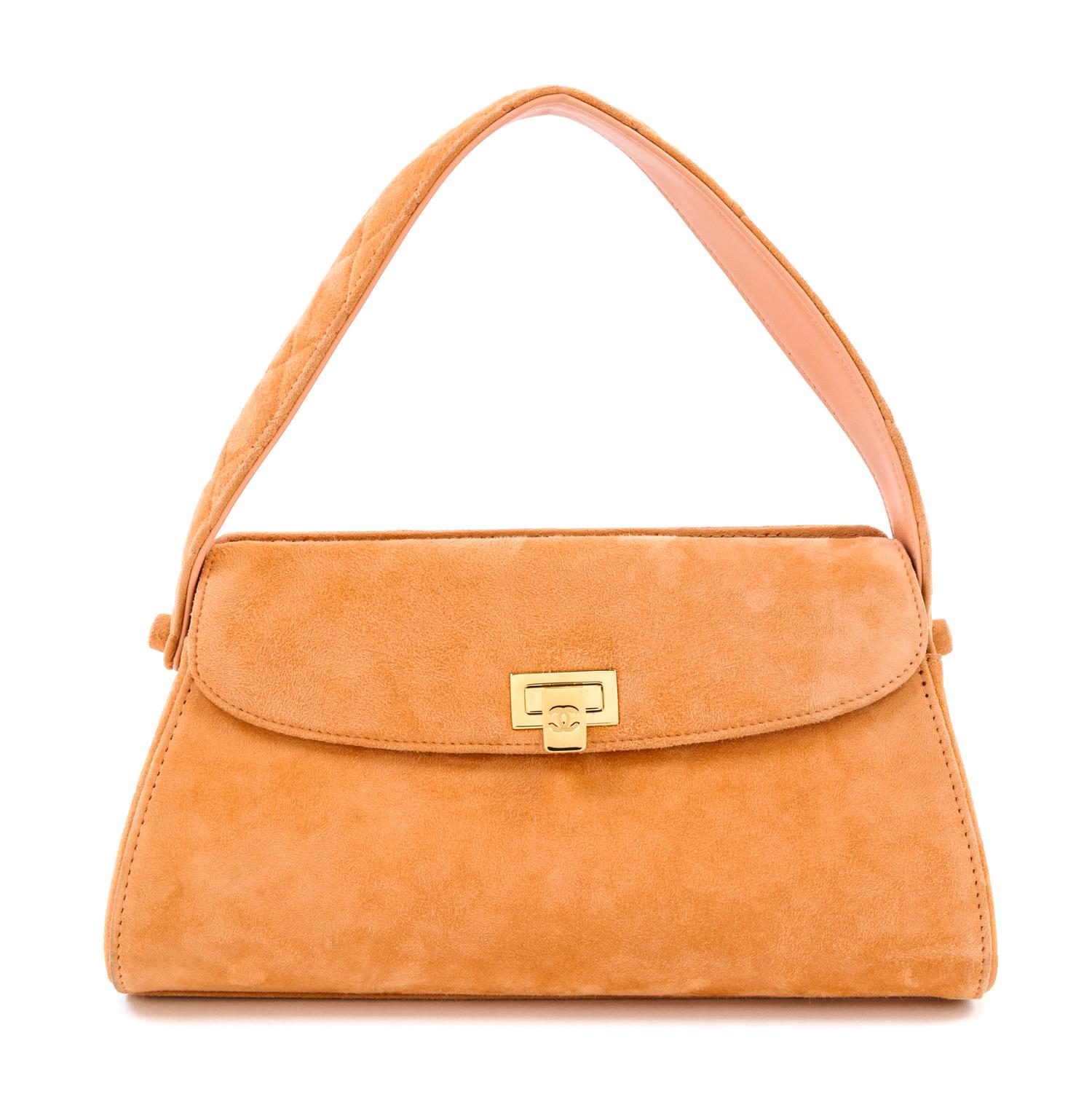 A Chanel Peach Suede Handbag, 10.5" x 6" x 4"; Handle drop: 4.75".