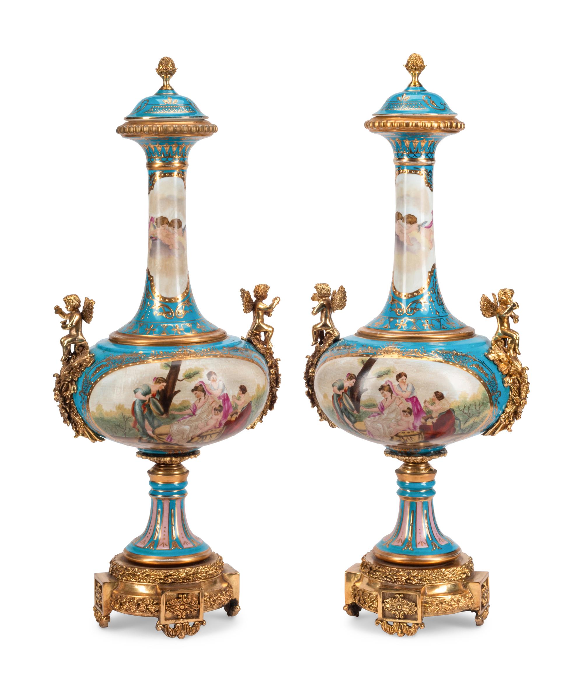 A Pair of Gilt Bronze Mounted Sèvres Style Porcelain Vases and Covers