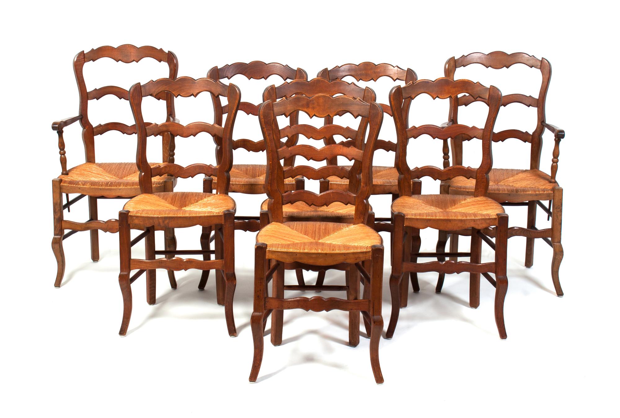 A Set of Eight Ladderback Dining Chairs Height 38 1/4 inches.