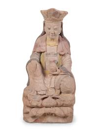 A Chinese Carved Stone Seated Figure with Polychrome Decoration