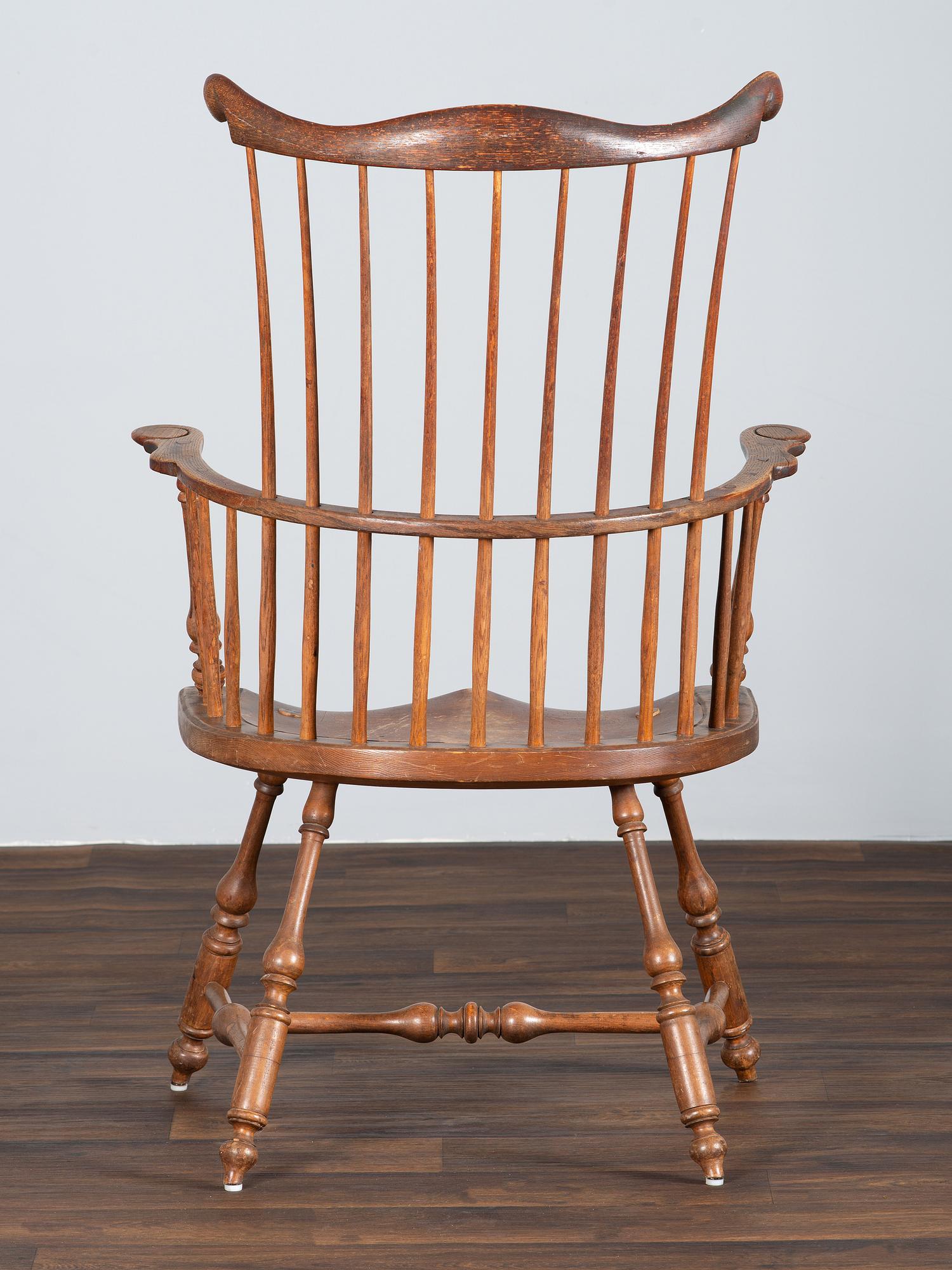 A Volute and Scroll Carved and Reel Turned Windsor Armchair
