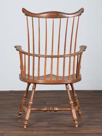 A Volute and Scroll Carved and Reel Turned Windsor Armchair