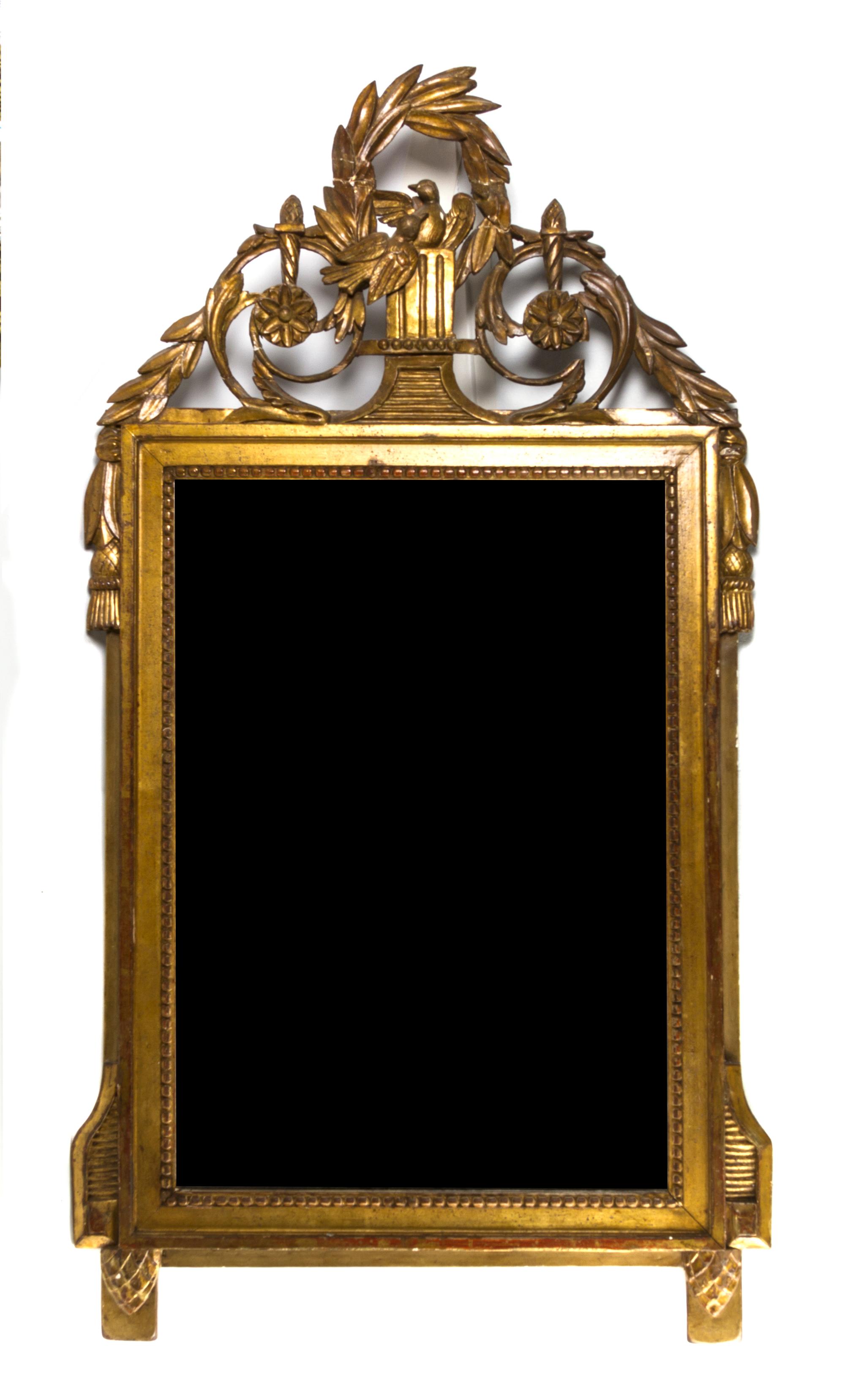 An Italian Giltwood Mirror, Height 34 1/2 x width 21 1/2 inches.