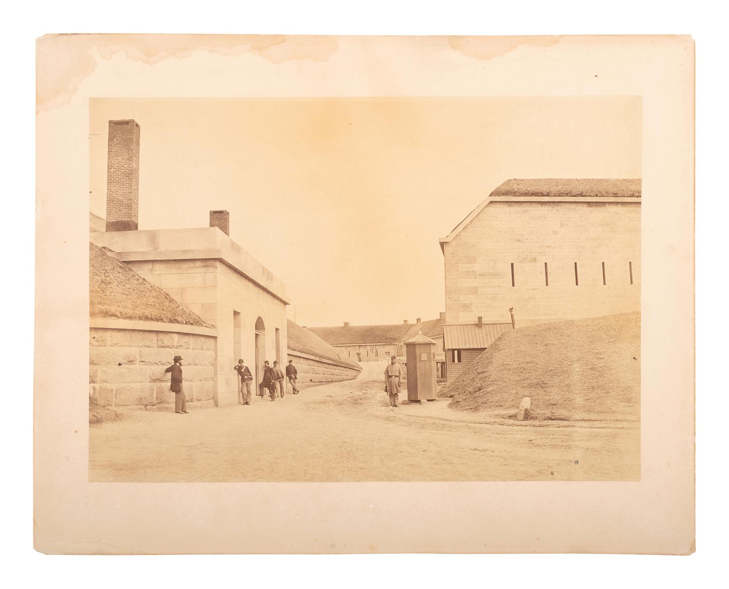 [CIVIL WAR]. Albumen photograph of soldiers and civilian at Fort Warren. Georges Island, MA. 1861.