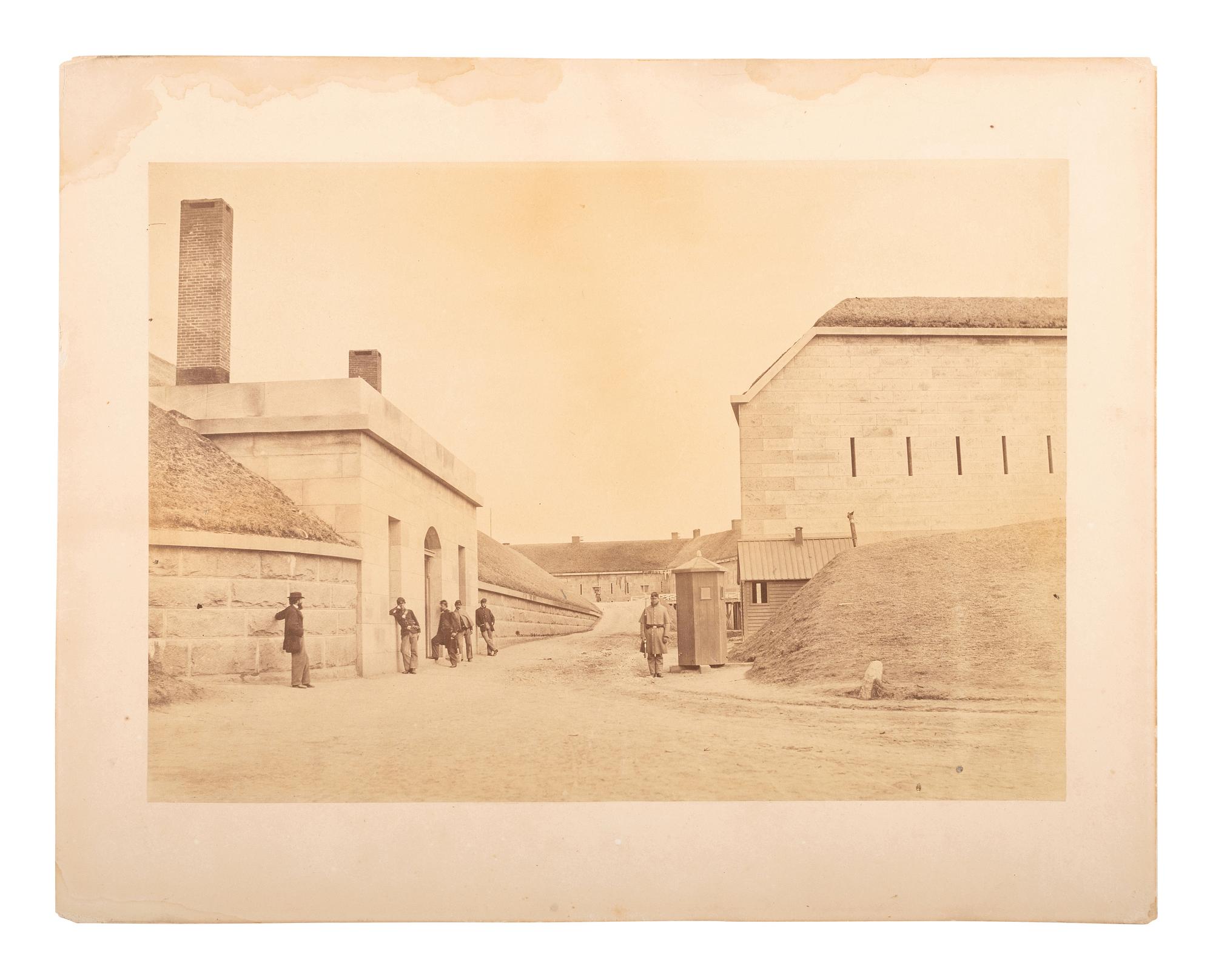 [CIVIL WAR]. Albumen photograph of soldiers and civilian at Fort Warren. Georges Island, MA. 1861.