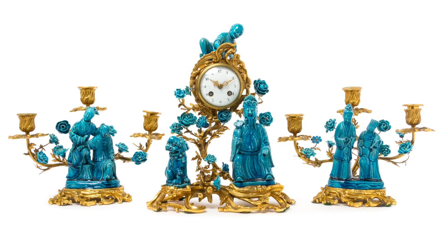 A French Gilt Bronze and Chinese Porcelain Clock Garniture Height of clock 15 inches. — MOVEMENT BY SAMUEL MARTI, CIRCA 1900