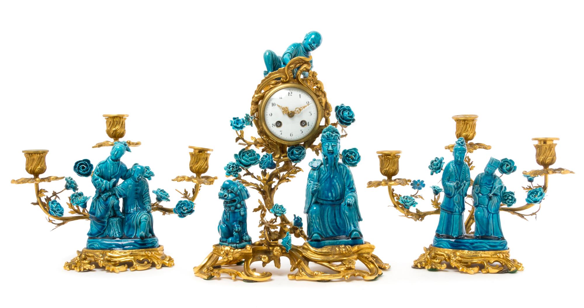 A French Gilt Bronze and Chinese Porcelain Clock Garniture Height of clock 15 inches. — MOVEMENT BY SAMUEL MARTI, CIRCA 1900