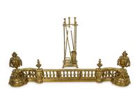 A Neoclassical Brass Fire Fender with a Set of Tools