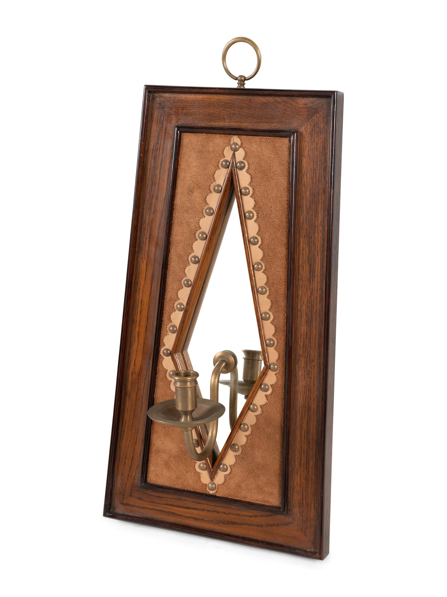 A Pair of Brass Mounted Suede-Inset Oak Mirrored Sconces