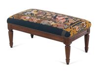 A Louis XVI Style Walnut Bench with a Needlepoint Seat