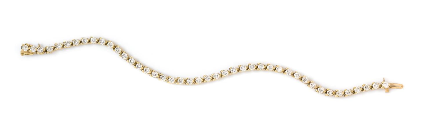 A Yellow Gold and Diamond Line Bracelet, 8.60 dwts.