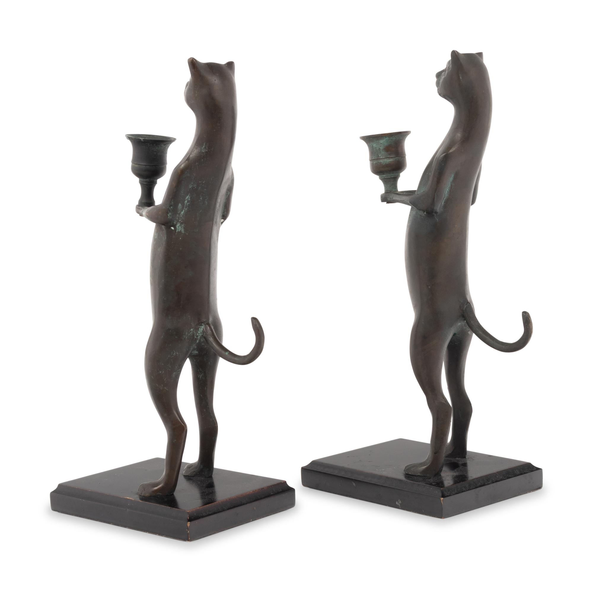 A Pair of Pewter Cat-Form Candlesticks