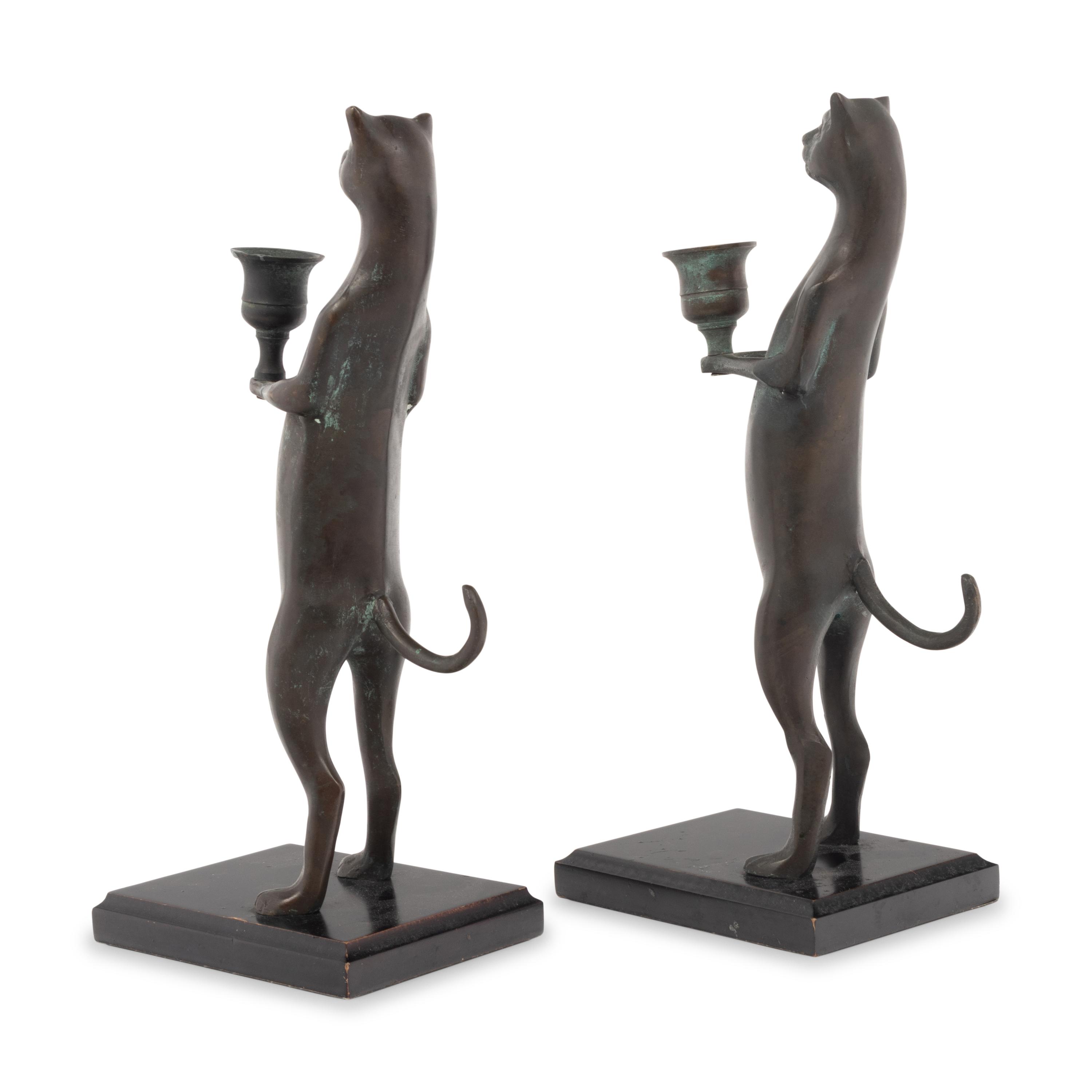 A Pair of Pewter Cat-Form Candlesticks