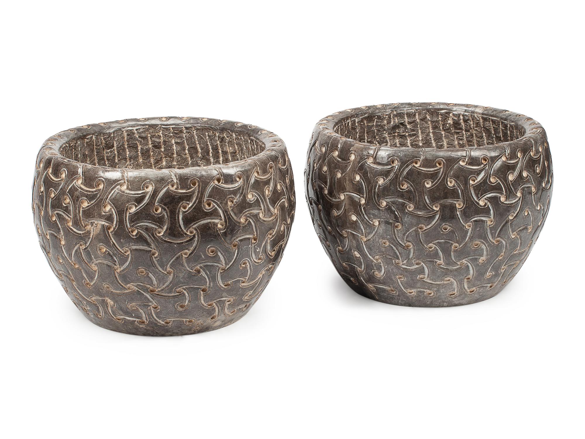 A Pair of Celtic Style Carved Stone Jardinieres