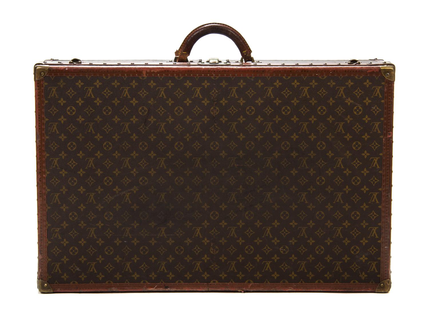 A Louis Vuitton Monogram Canvas Hardsided Suitcase, 31 1/2 x 20 x 8 1/2 inches.