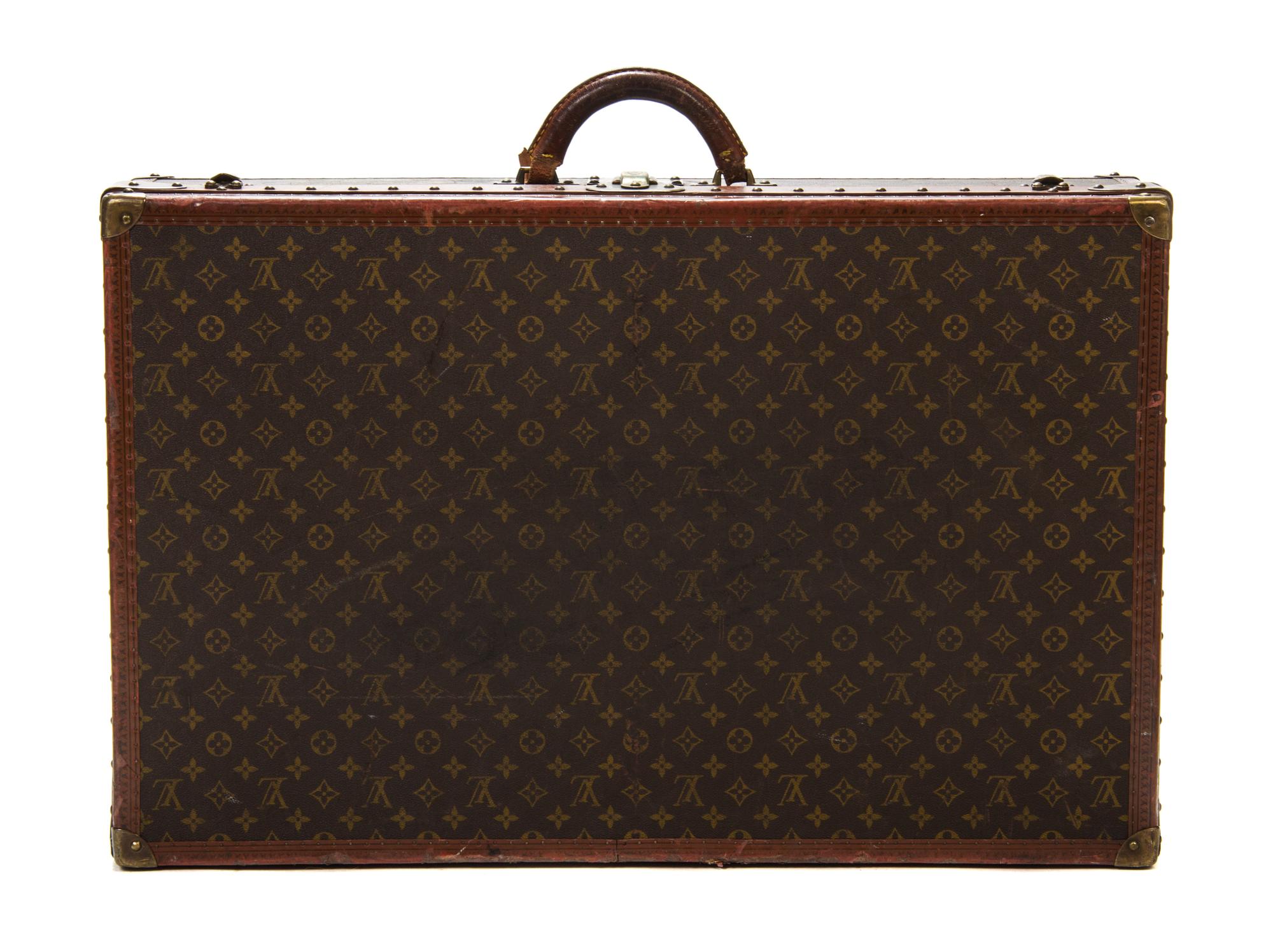 A Louis Vuitton Monogram Canvas Hardsided Suitcase, 31 1/2 x 20 x 8 1/2 inches.
