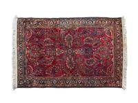 A Sarouk Wool Rug 4 feet 11 inches x 3 feet 9 inches.