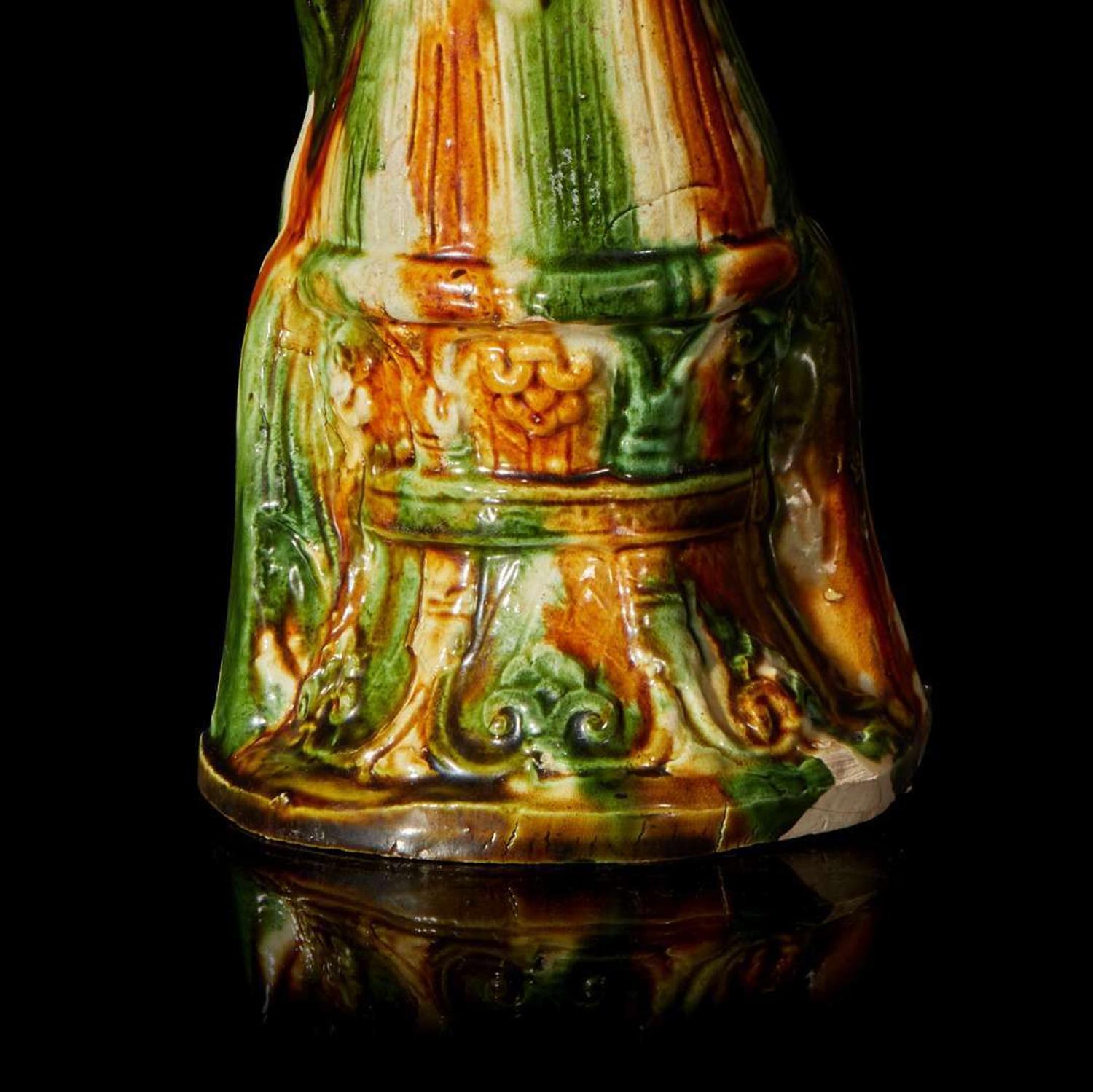 A Chinese sancai-glazed pottery figure of a seated woman 唐三彩仕女坐像 Tang dynasty ?