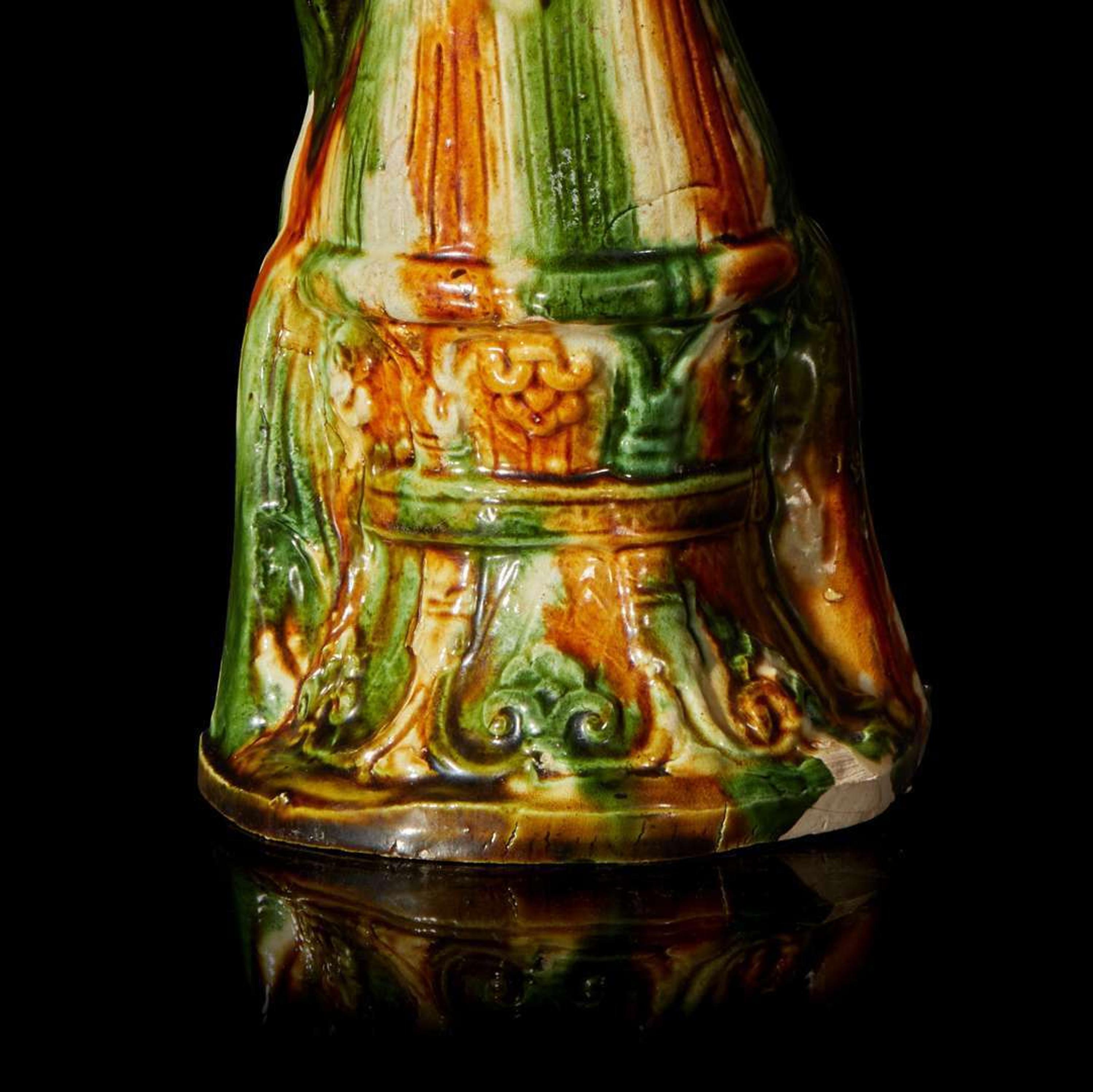 A Chinese sancai-glazed pottery figure of a seated woman 唐三彩仕女坐像 Tang dynasty ?